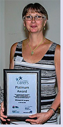 Kim Munro with 2018 Platinum Carers' Award presented to Whiteparish Surgery